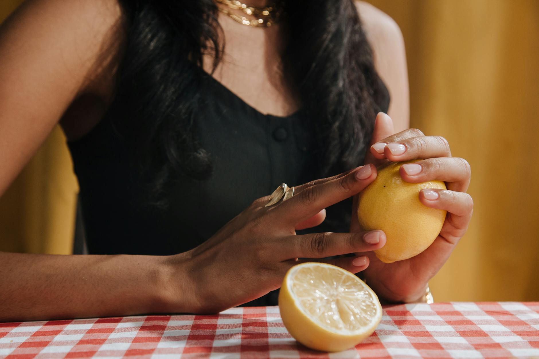 Close-up of hands holding a sleek vibrator, emphasizing intimate sensory touch